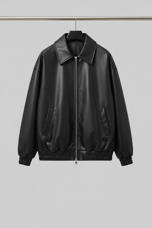 Black leather bomber jacket on hanger