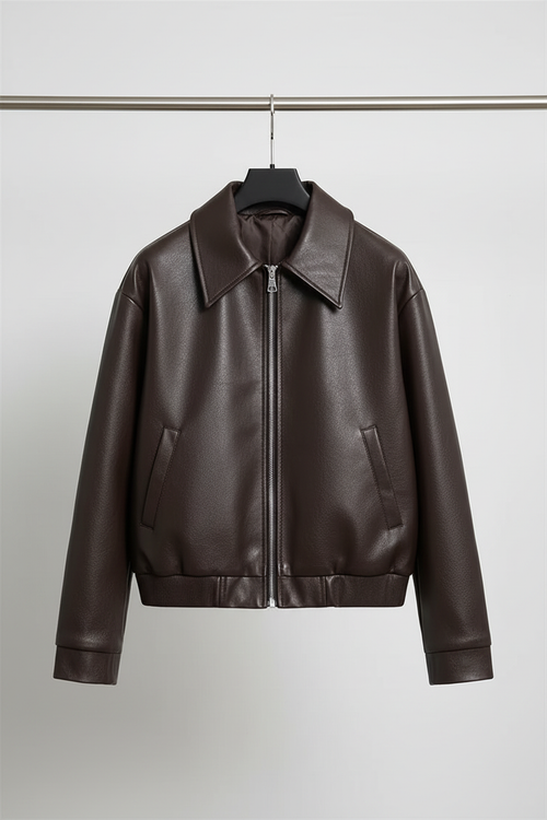 Brown leather bomber jacket on hanger