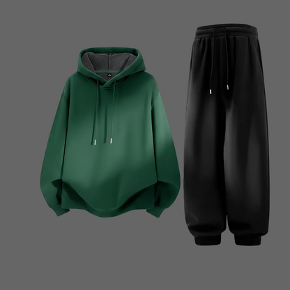 Forest green hoodie and black joggers - flat lay