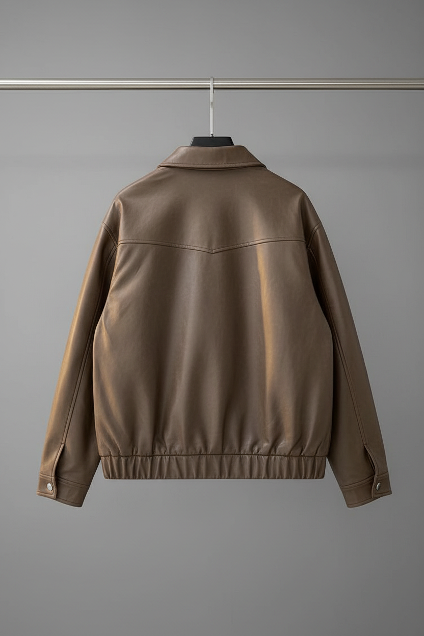 Taupe leather bomber jacket on hanger - back view