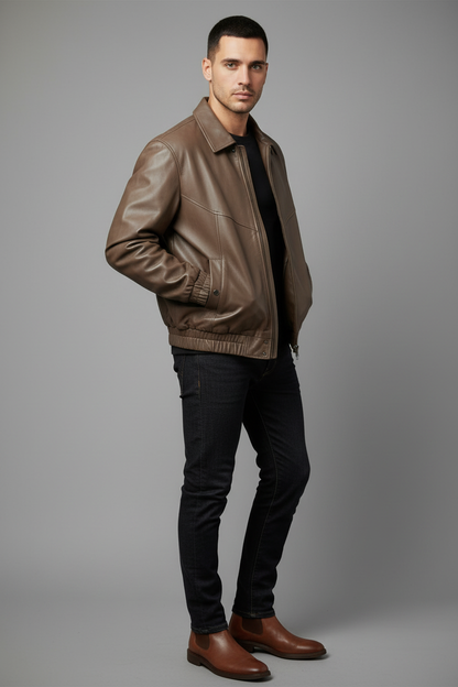 Model wearing taupe leather bomber jacket - side angle