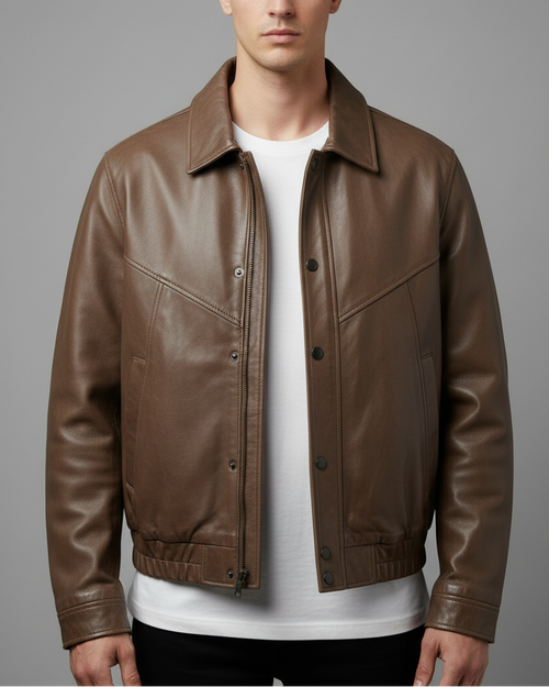 Model wearing taupe leather bomber jacket - front view