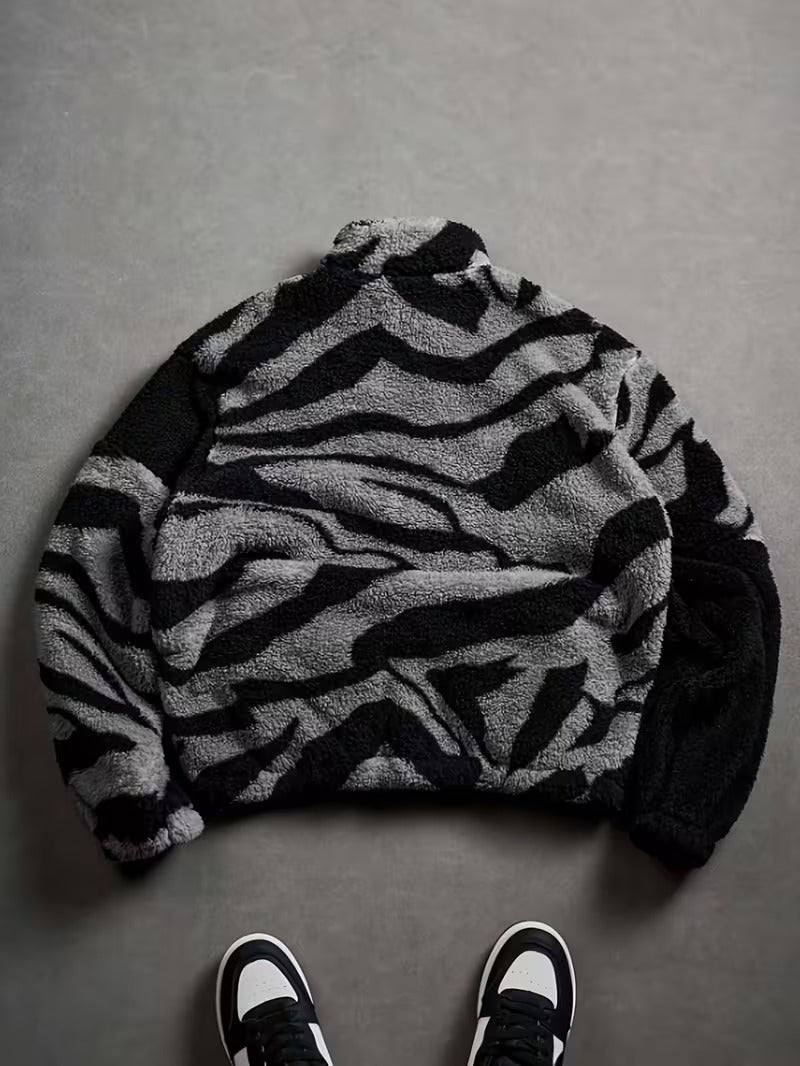 lack Plush Jacket with a Zip-Up Collar And Double Pockets, Featuring a Striking Zebra Pattern.