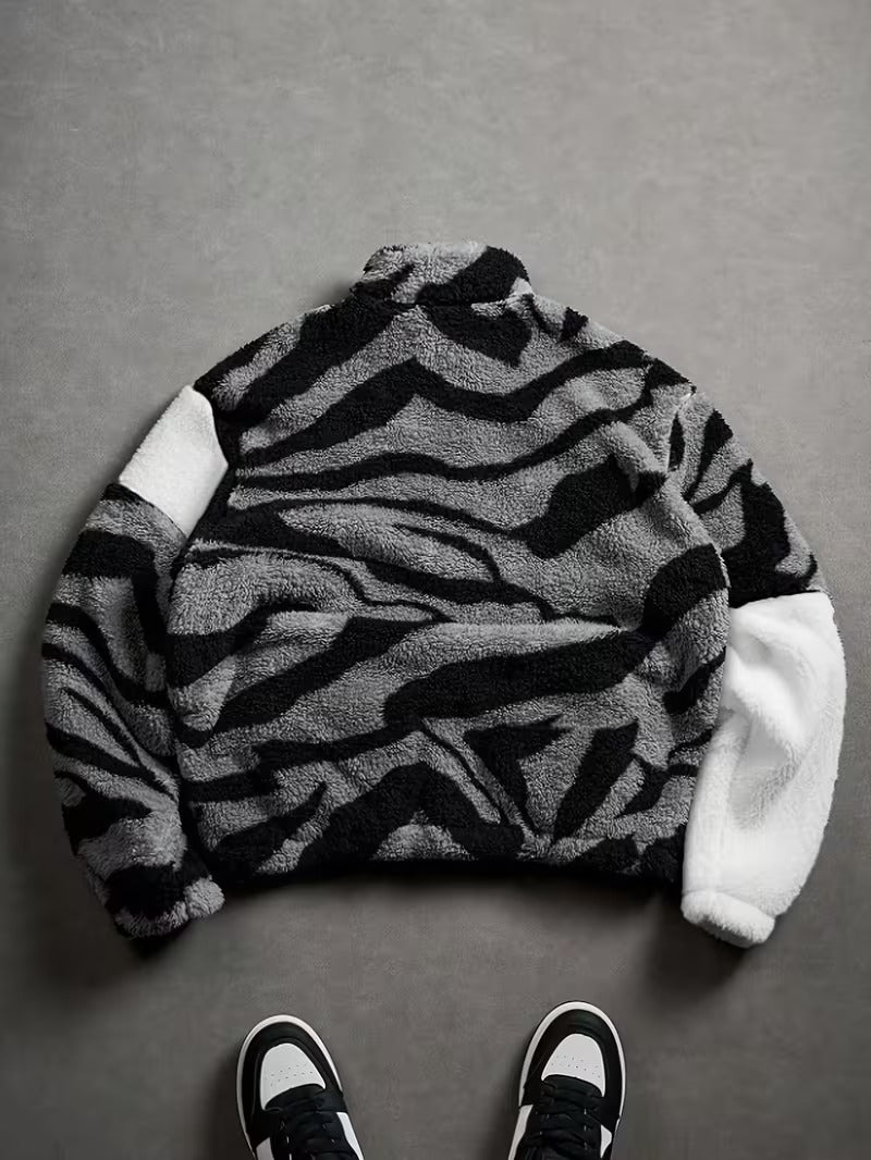 lack Plush Jacket with a Zip-Up Collar And Double Pockets, Featuring a Striking Zebra Pattern.
